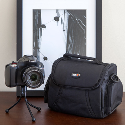 CANON® PowerShot SX40 HS Digital Camera - Capture amazing photos and videos with this compact point-and-shoot camera. Canon DIGIC 5 Image Processor and a high-sensitivity 12.1 Megapixel CMOS sensor boosts low-light performance and 35x Optical Zoom offers incredible reach and range.  Includes digital camera with 16GB bundle, SDHC memory card and memory card wallet, NB-10L replacement battery, pack of three screen protectors, mini table-top tripod, lens cleaning kit, deluxe gadget bag and hi-speed SD USB 2.0 card reader.